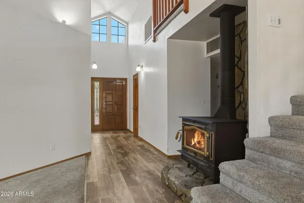 a view of an entryway with wooden floor