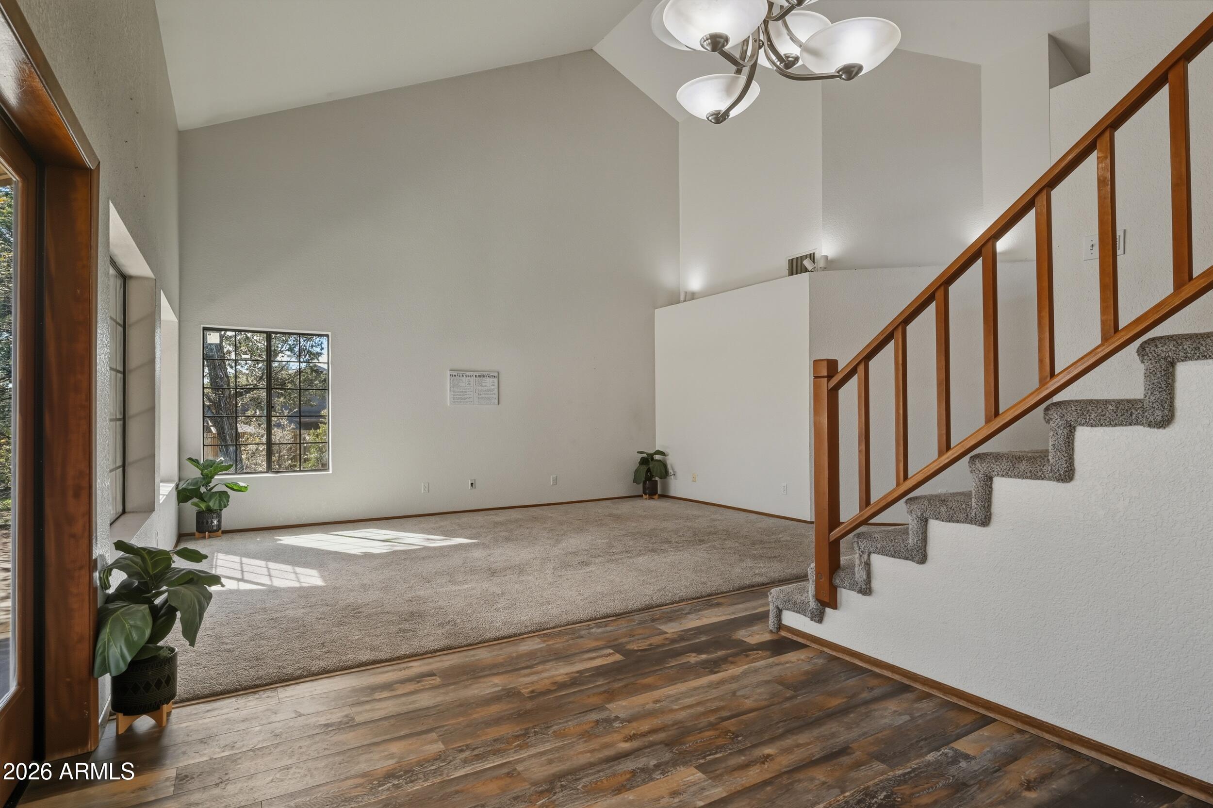 1101 North McLane Road Payson, AZ 85541 - Photo 24 of 65 a view of an entryway with wooden floor and stairs