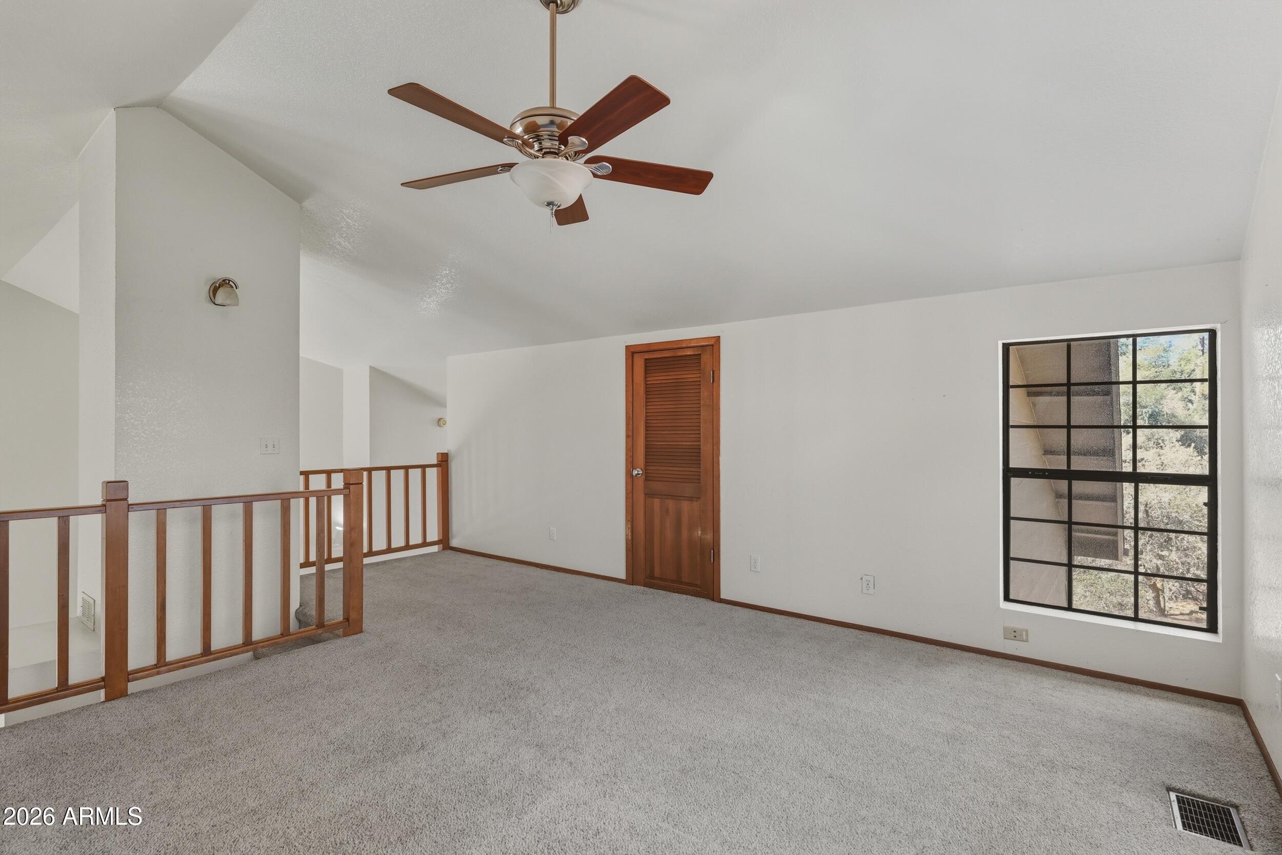 1101 North McLane Road Payson, AZ 85541 - Photo 26 of 65 an empty room with windows and fan