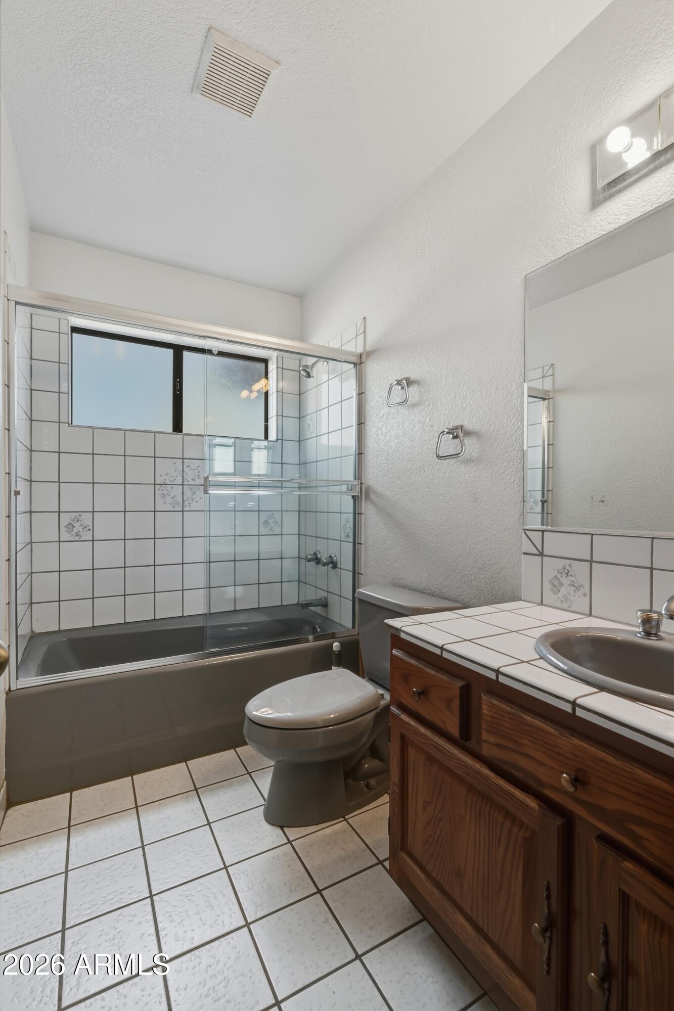 1101 North McLane Road Payson, AZ 85541 - Photo 30 of 65 a bathroom with a sink a toilet a mirror and shower