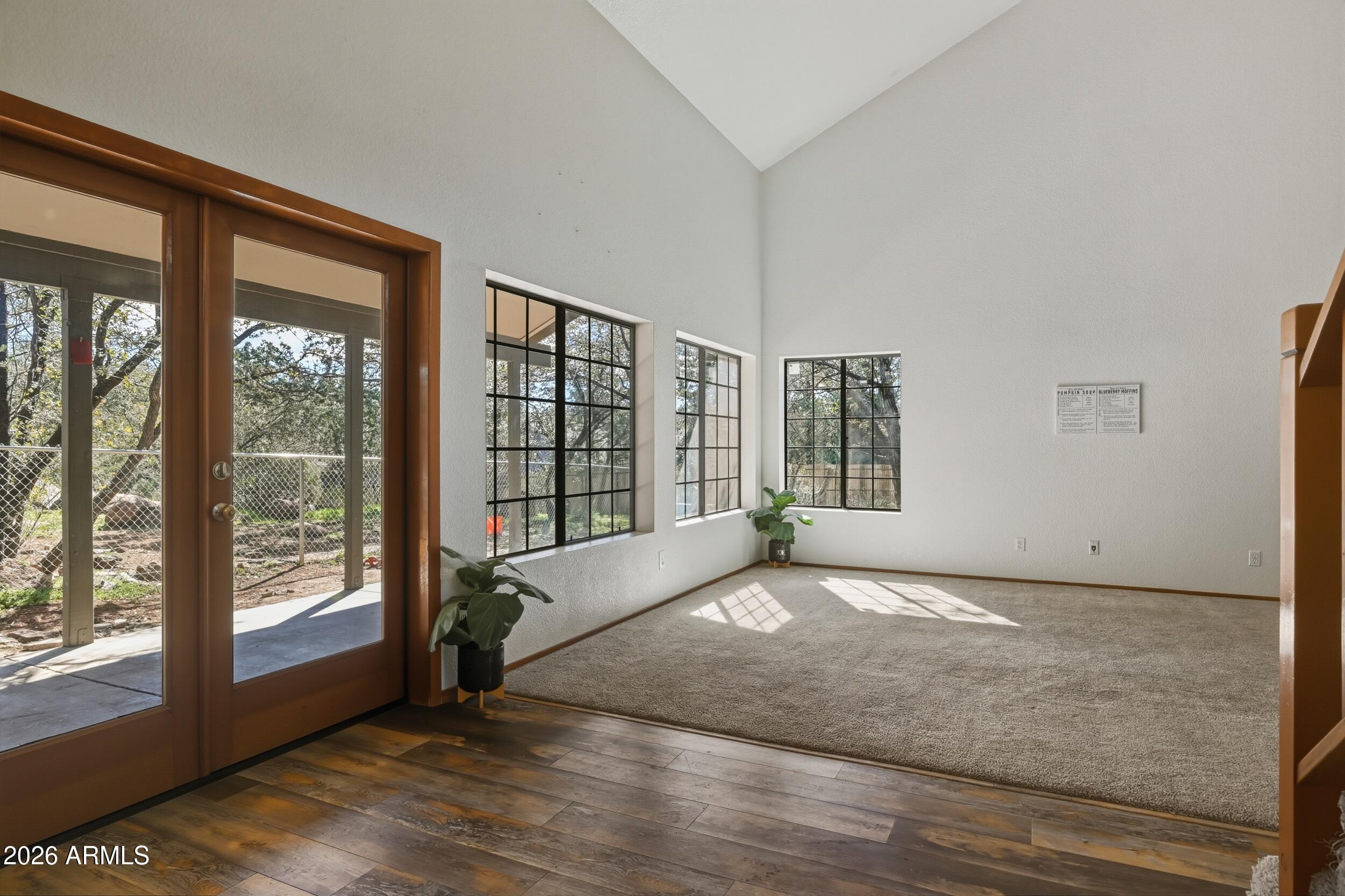 1101 North McLane Road Payson, AZ 85541 - Photo 31 of 65 a view of an empty room with wooden floor and a window