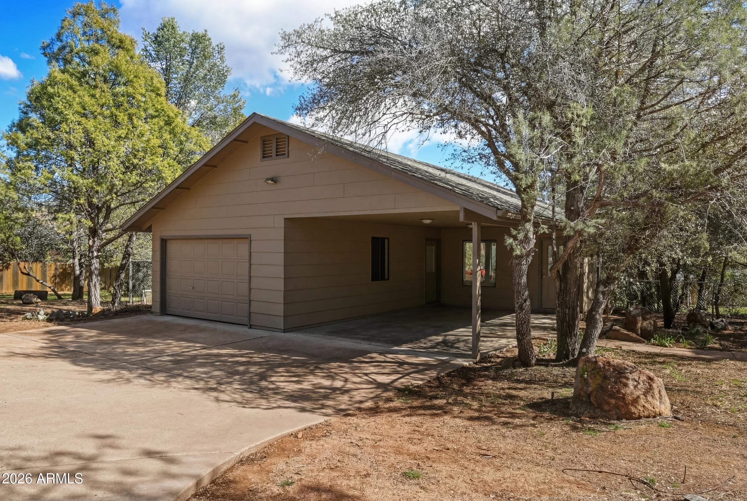 1101 North McLane Road Payson, AZ 85541 - Photo 35 of 65 a view of a house with a yard covered in snow