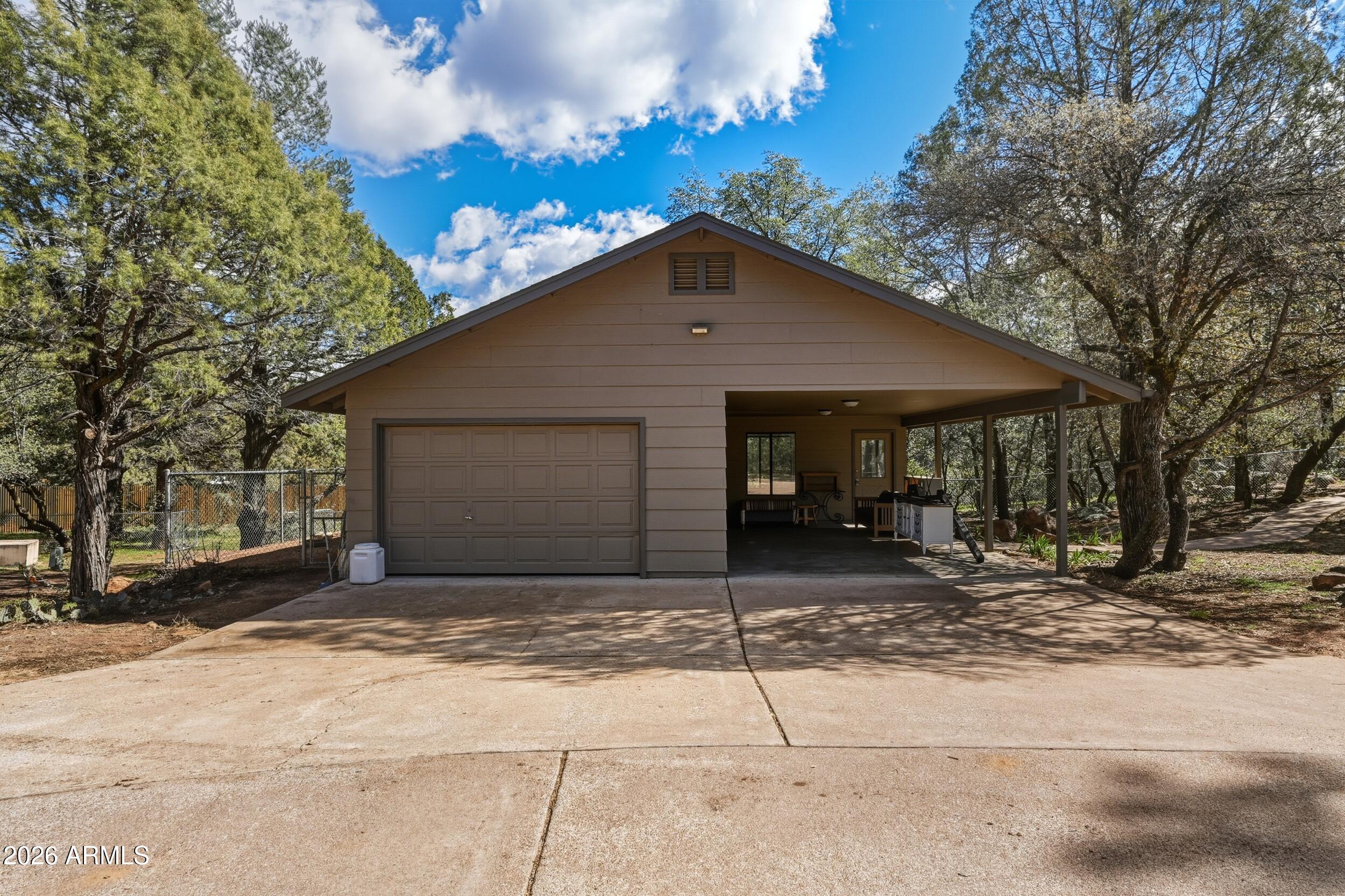 1101 North McLane Road Payson, AZ 85541 - Photo 36 of 65 a front view of a house with a garage