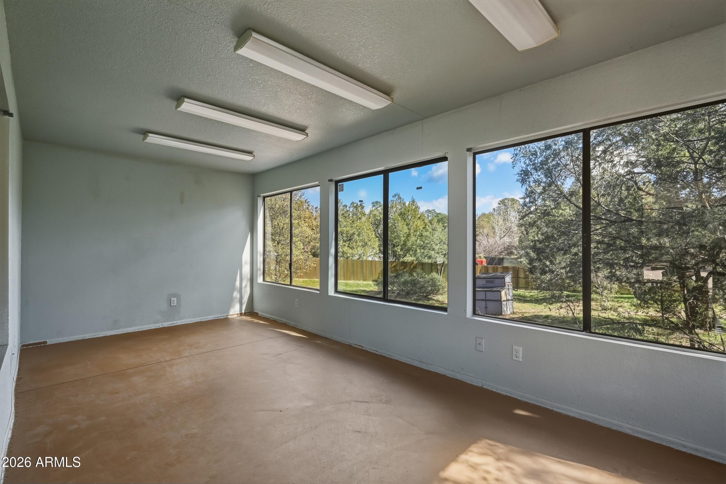 1101 North McLane Road Payson, AZ 85541 - Photo 39 of 65 a view of an empty room with a large window