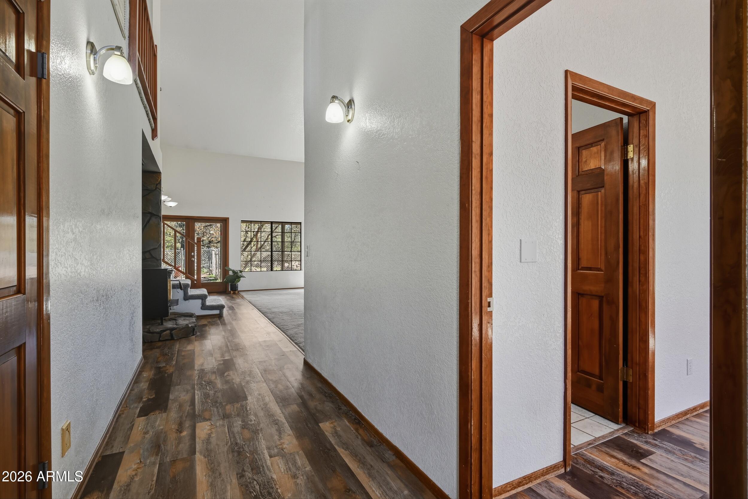 1101 North McLane Road Payson, AZ 85541 - Photo 8 of 65 a view of a hallway with wooden floor and staircase