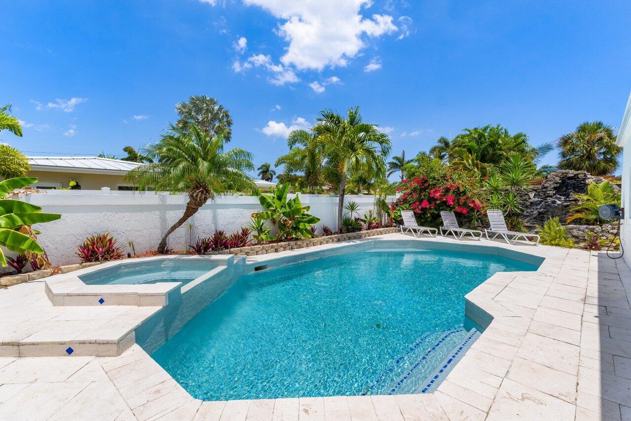 2611 Northeast 49th Street Lighthouse Point, FL 33064 - Photo 33 of 56 a view of pool with outdoor seating