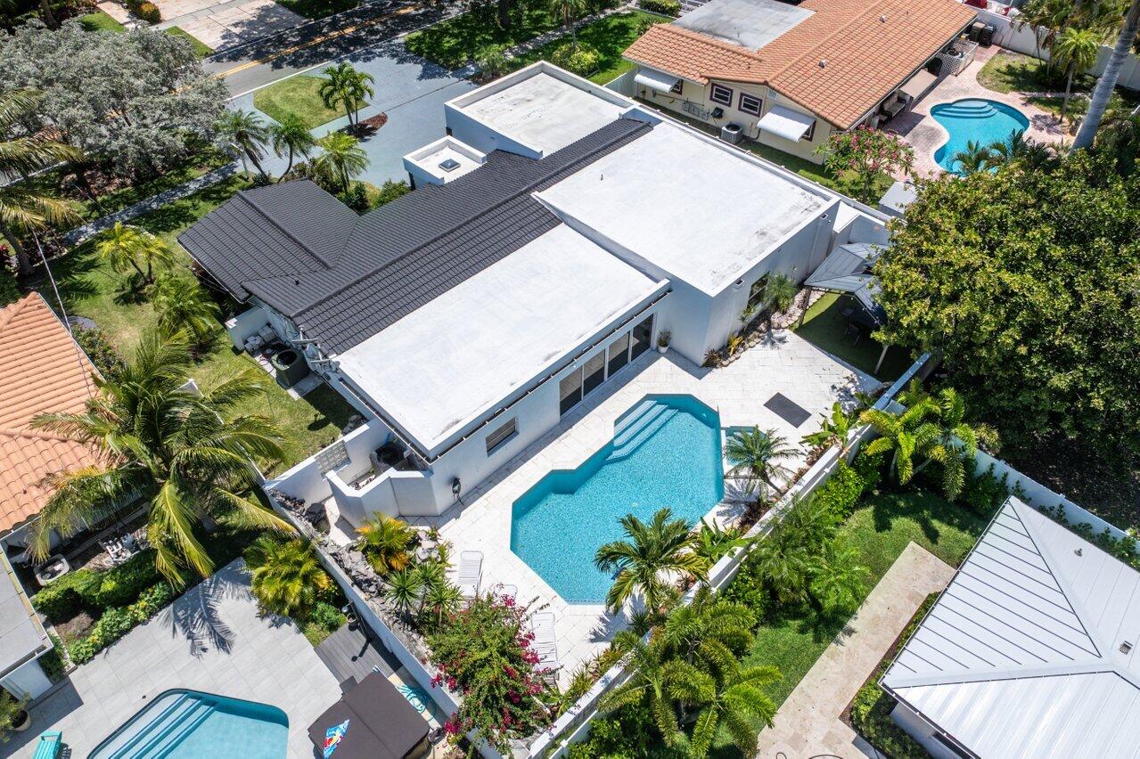 2611 Northeast 49th Street Lighthouse Point, FL 33064 - Photo 42 of 56 an aerial view of a house with a garden