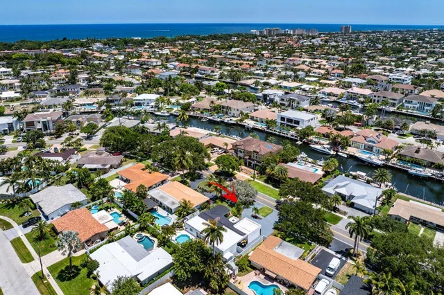 an aerial view of residential houses with outdoor space