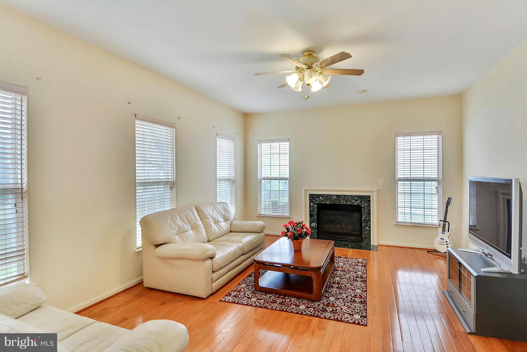 17904 Coachmans Road Germantown, MD 20874 - Photo 12 of 30 Hardwood Floor and Gas Fireplace