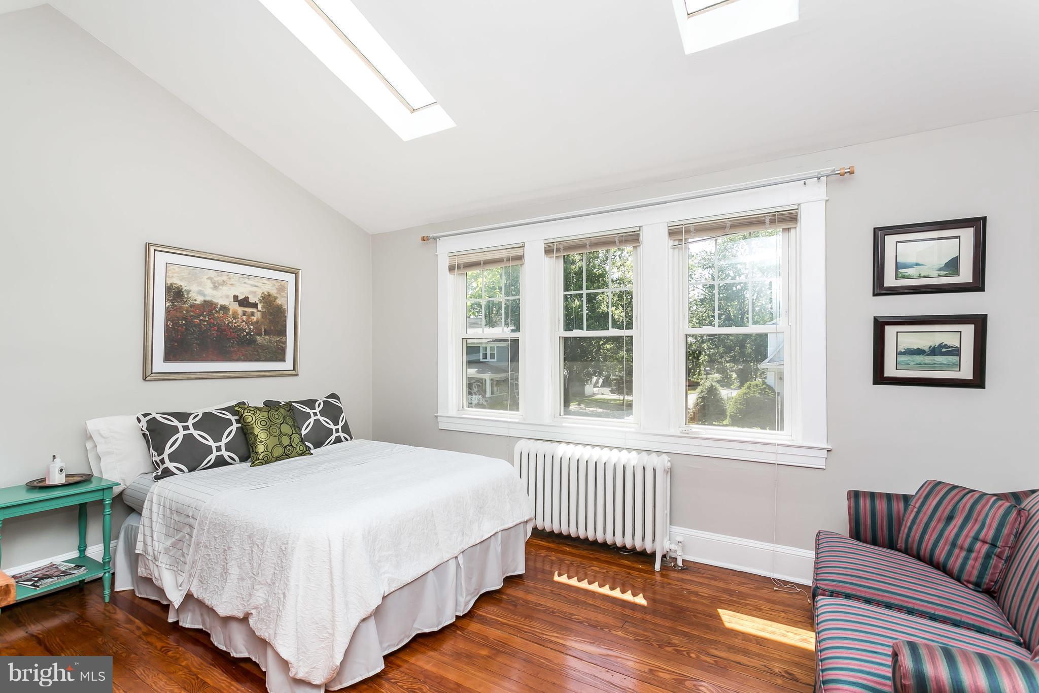 21 Mallow Hill Road Baltimore, MD 21229 - Photo 22 of 30 a bedroom with a bed and a couch