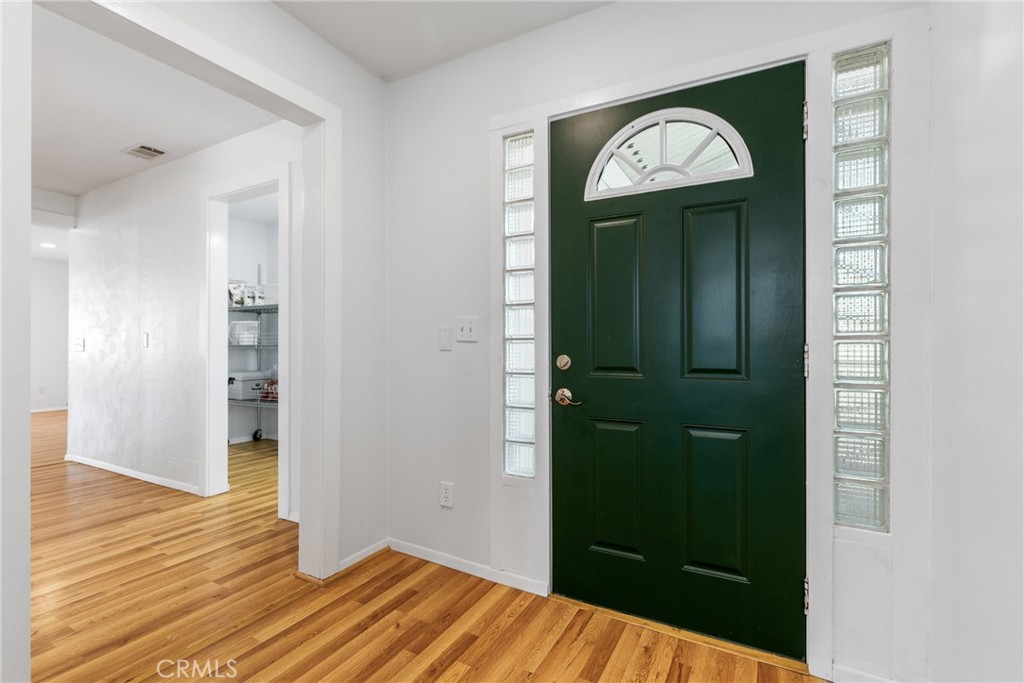 7990 San Gabriel Road Atascadero, CA 93422 - Photo 11 of 69 a view of a hallway with wooden floor