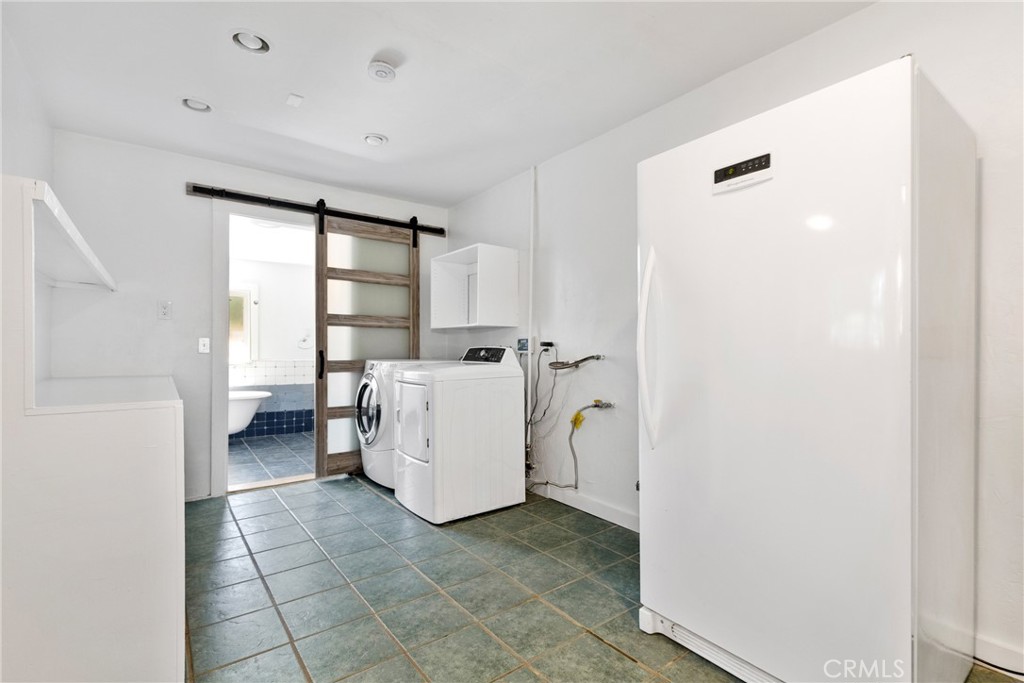 7990 San Gabriel Road Atascadero, CA 93422 - Photo 14 of 69 a view of a storage & utility room with washer and dryer