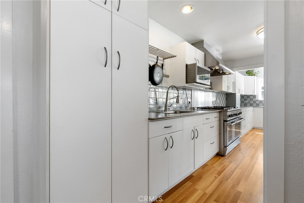 7990 San Gabriel Road Atascadero, CA 93422 - Photo 22 of 69 a kitchen with granite countertop a sink and stainless steel appliances