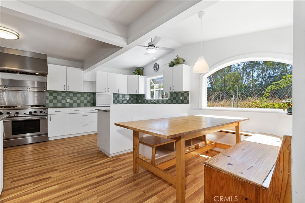 7990 San Gabriel Road Atascadero, CA 93422 - Photo 29 of 69 Next to the kitchen is an eating nook. The built-in benches have storage.