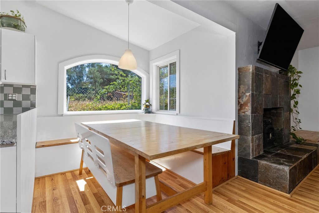 7990 San Gabriel Road Atascadero, CA 93422 - Photo 30 of 69 a room with table chairs and a flat screen tv