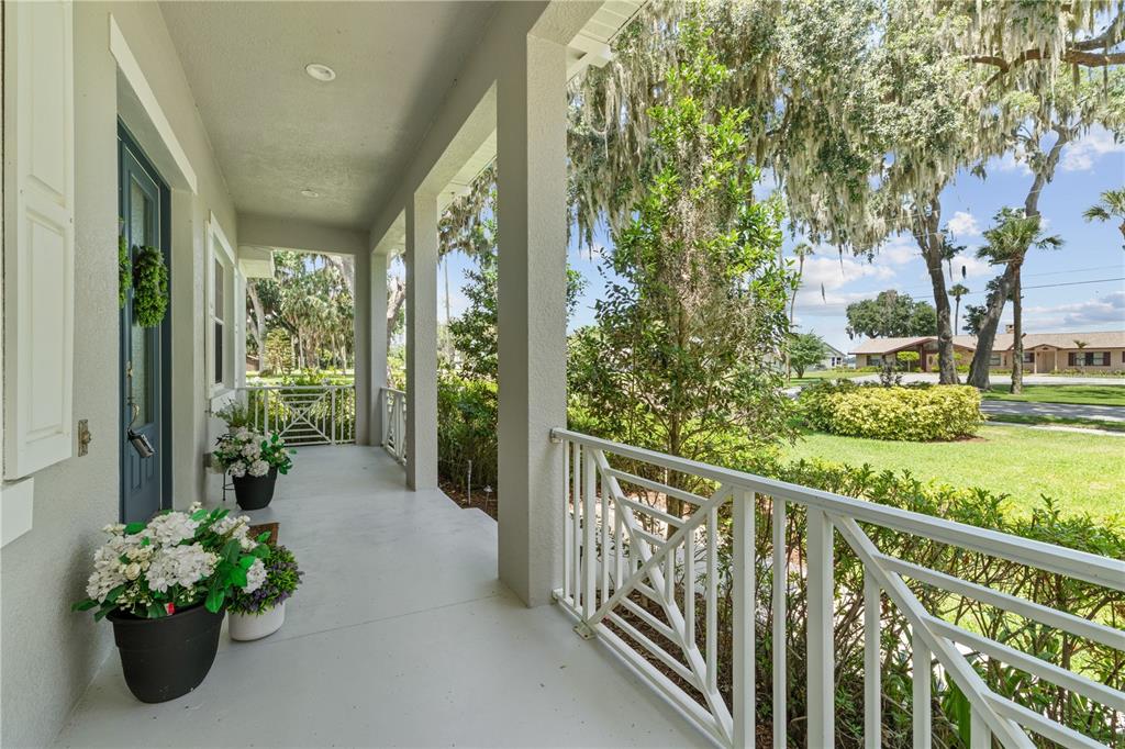 16948 Deer Island Road Tavares, FL 32778 - Photo 58 of 67 a view of a balcony with wooden floor