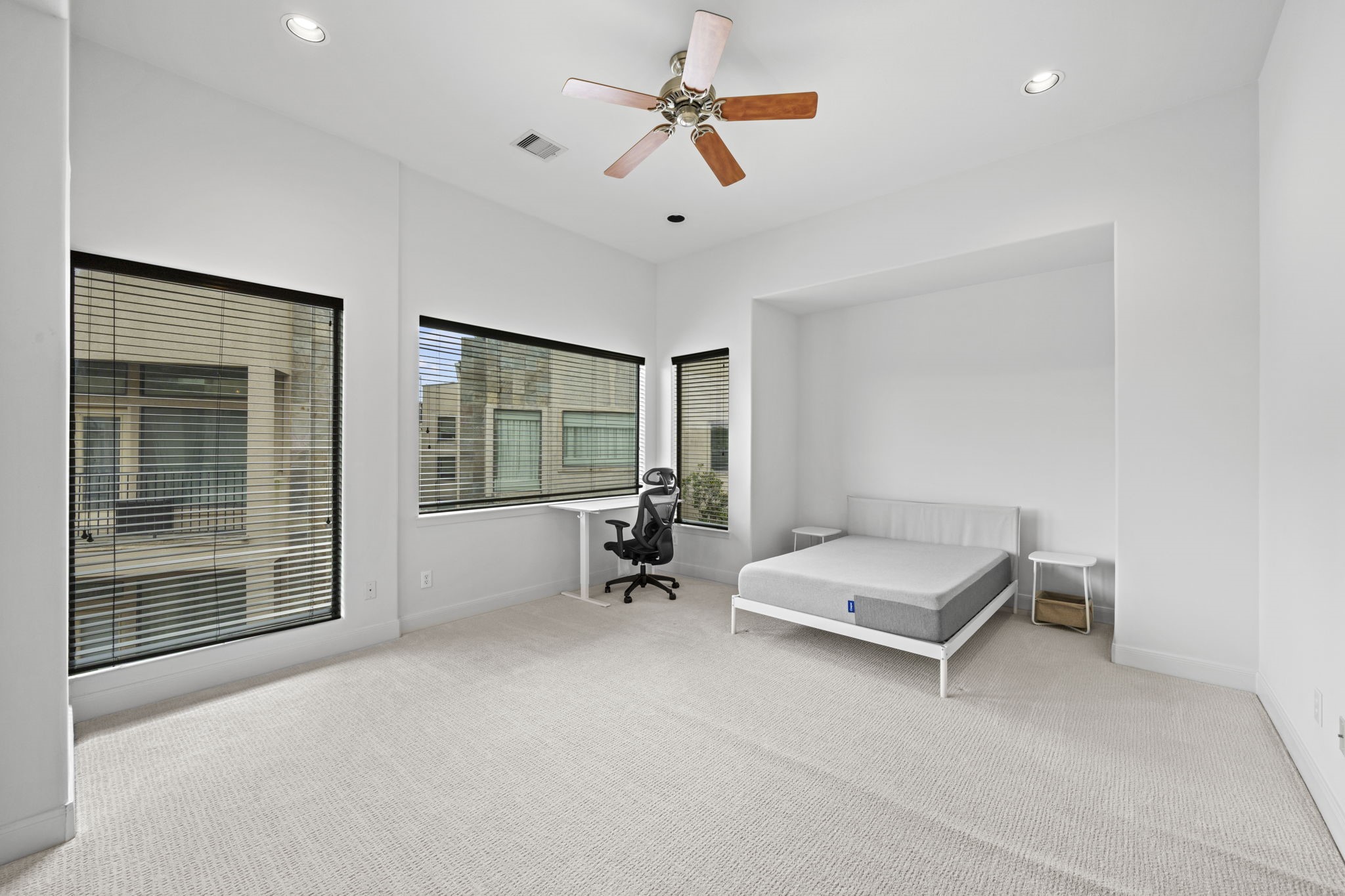 2413 Ralph Street, Unit 9 Houston, TX 77006 - Photo 13 of 19 Retreat to the expansive primary suite, complete with space for a sitting area, and a generous walk-in closet.