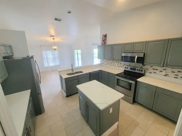 a bathroom with a double vanity sink toilet and shower