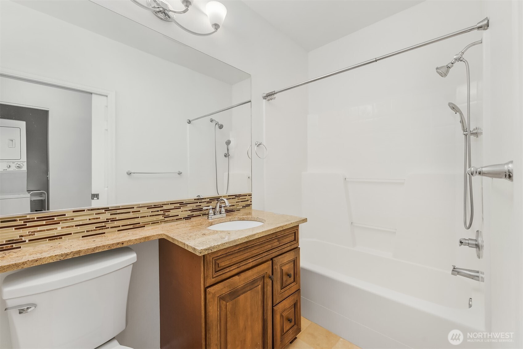 13000 Admiralty Way, Unit L104 Everett, WA 98204 - Photo 15 of 21 a bathroom with a granite countertop sink mirror toilet and bathtub