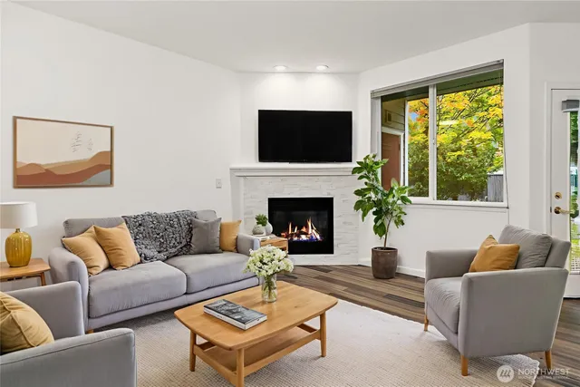 a living room with furniture fireplace and a flat screen tv