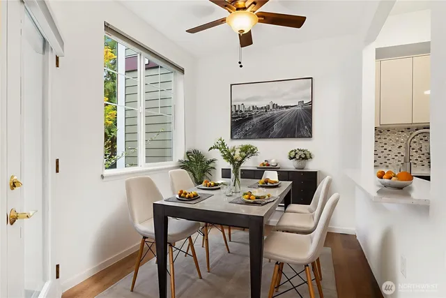 a view of a dining room with furniture window and outside view
