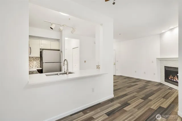 an empty room with cabinet and a fireplace