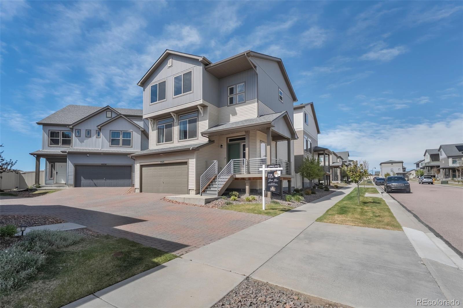 9528 Timberlake Loop Colorado Springs, CO 80927 - Photo 2 of 37 a view of a brick house with a yard
