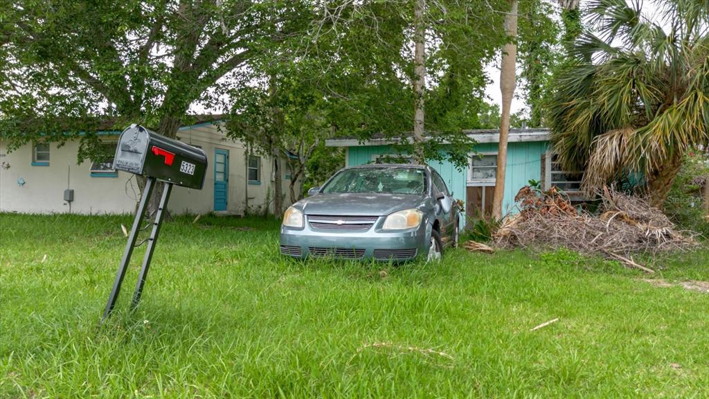 5323 Circle Drive Weeki Wachee, FL 34607 - Photo 76 of 77 a backyard of a house with table and chairs