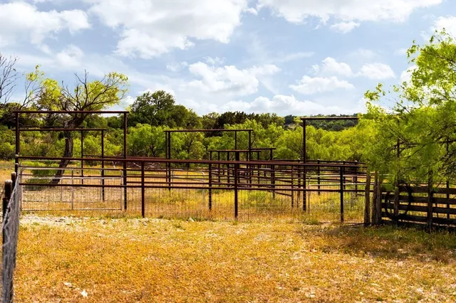 a view of swimming pool with sitting area