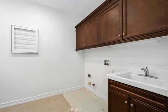 a bathroom with a sink and cabinets