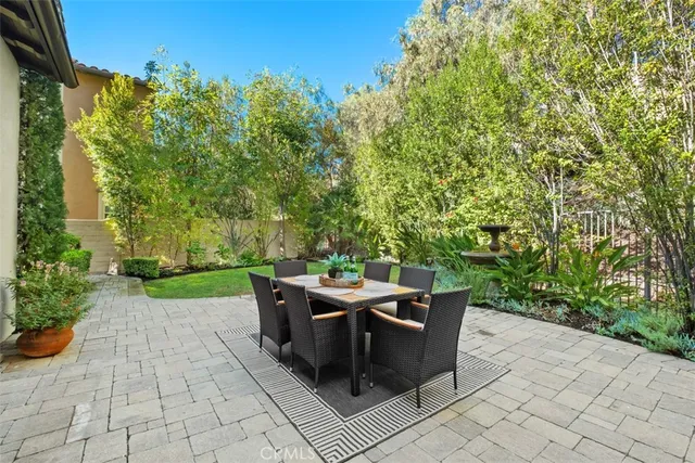 a view of a backyard with sitting area