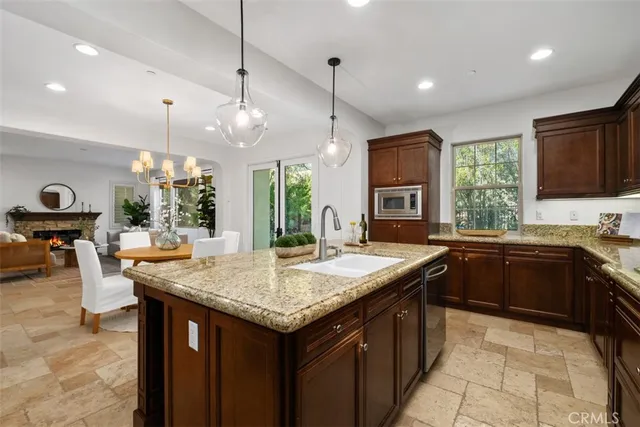 a kitchen with sink cabinets and outdoor living space