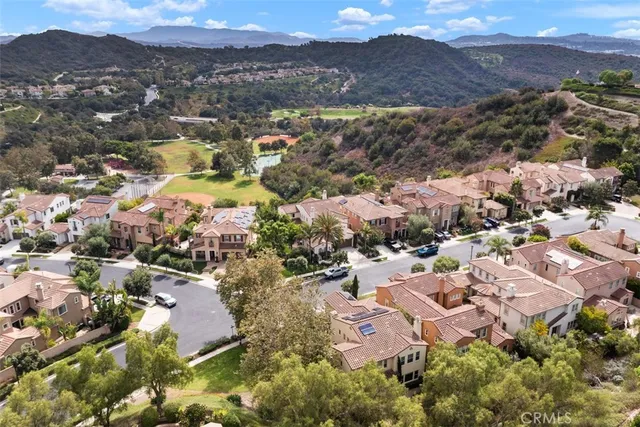 an aerial view of residential houses with outdoor space