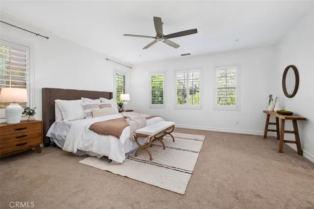 a bed room with a bed and a window