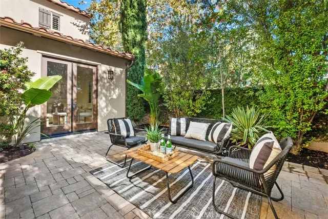 a view of a patio with couple of chairs
