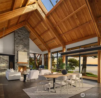 a living room with furniture and large windows