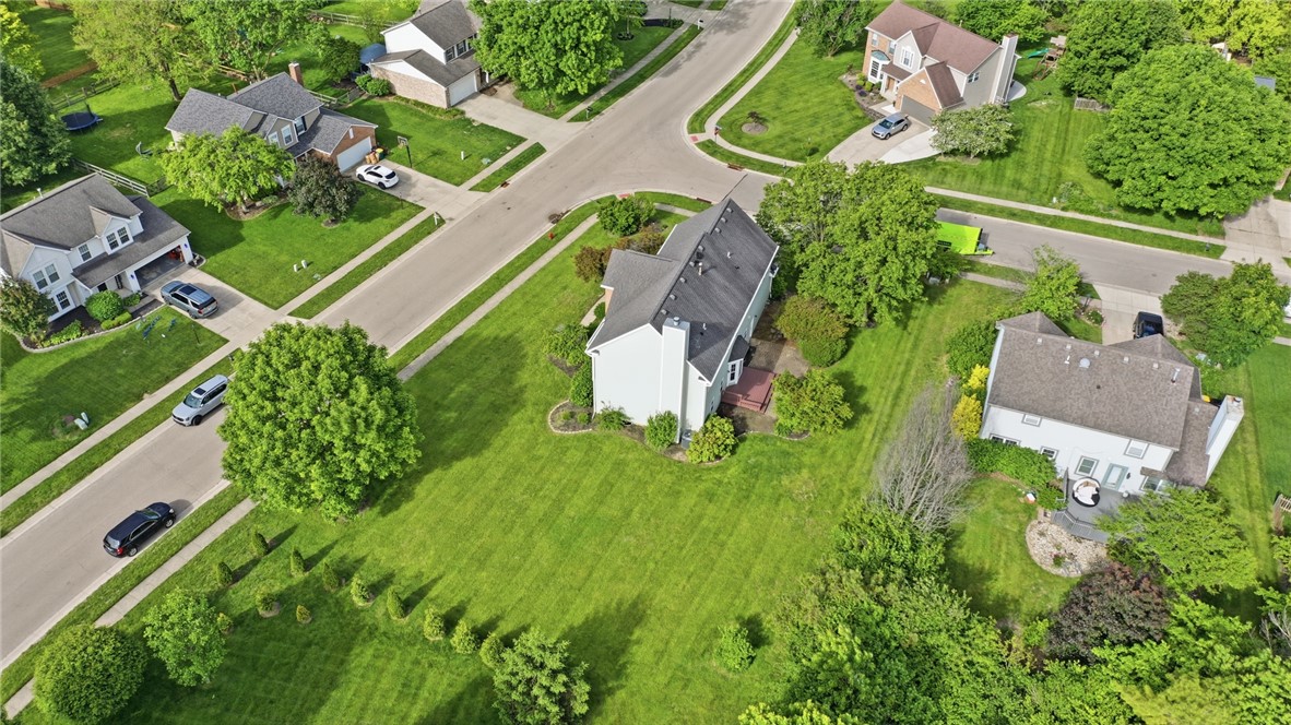 10 Chase Court Springboro, OH 45066 - Photo 72 of 75 An aerial view captures a quiet neighborhood with well-maintained homes and lush green lawns.