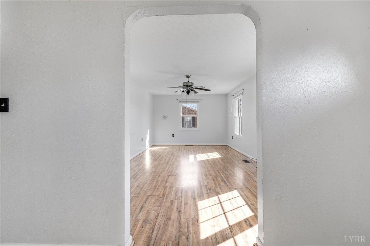 813 Doss Road Concord, VA 24538 - Photo 6 of 31 wooden floor in an empty room with a window