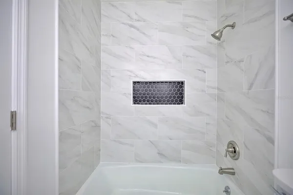 a bathroom with a shower and a toilet