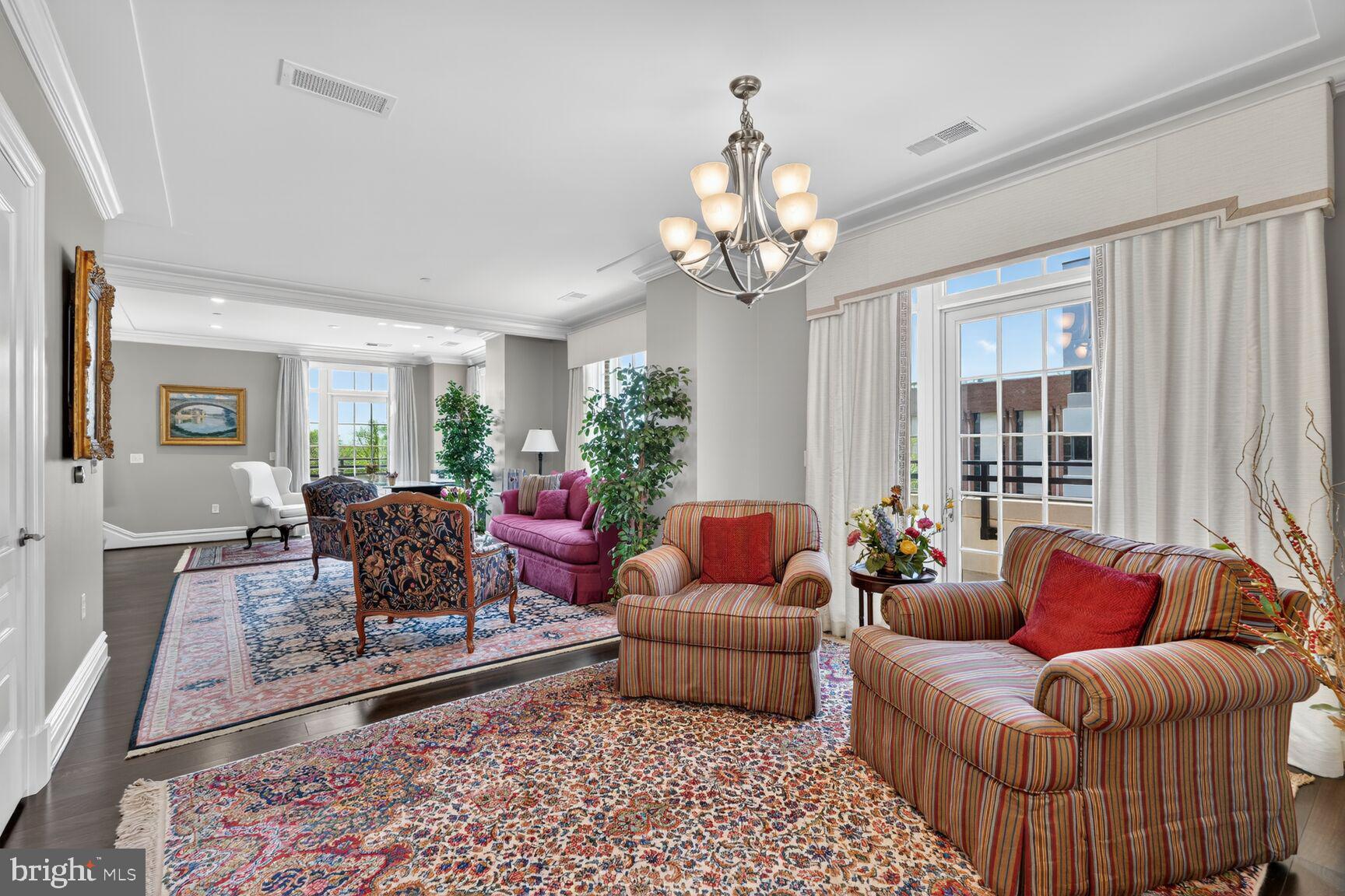 6900 Fleetwood Road, Unit 612 McLean, VA 22101 - Photo 20 of 42 a living room with furniture and a chandelier