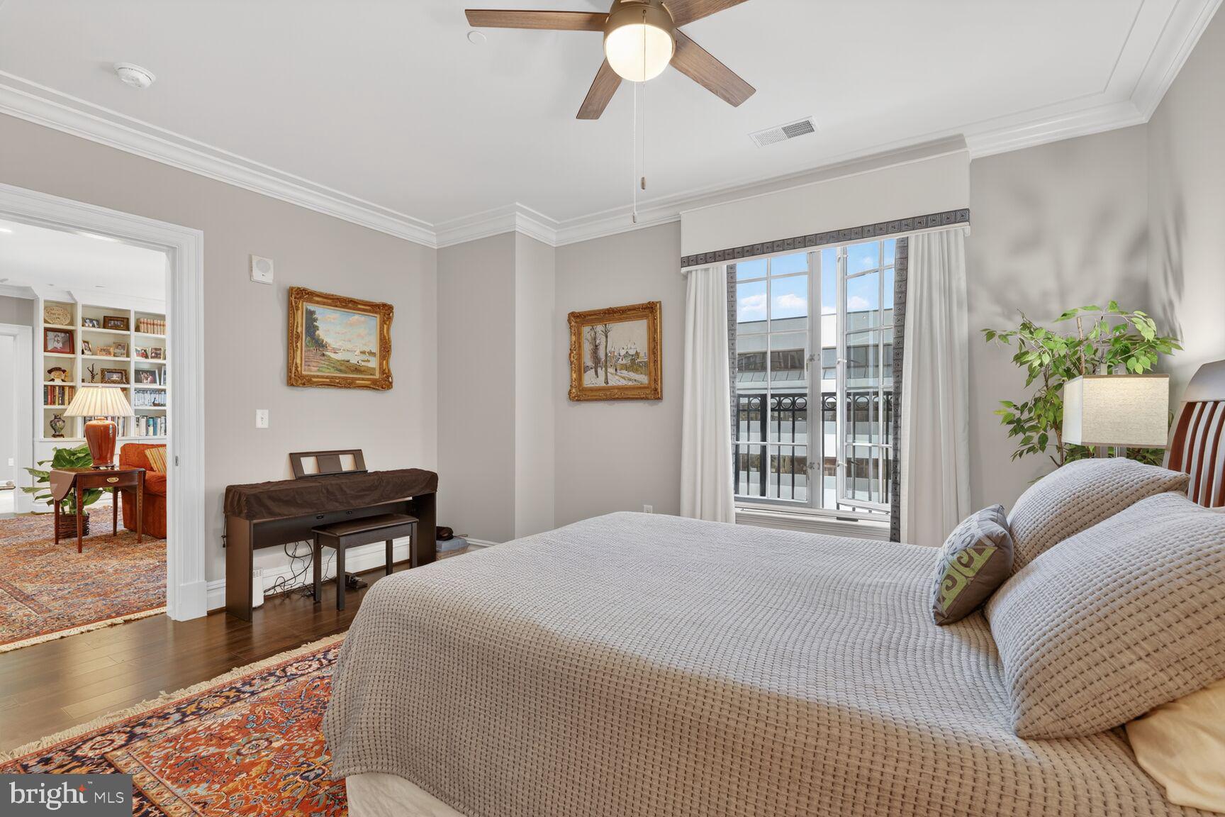 6900 Fleetwood Road, Unit 612 McLean, VA 22101 - Photo 33 of 42 a bedroom with a bed and a chandelier
