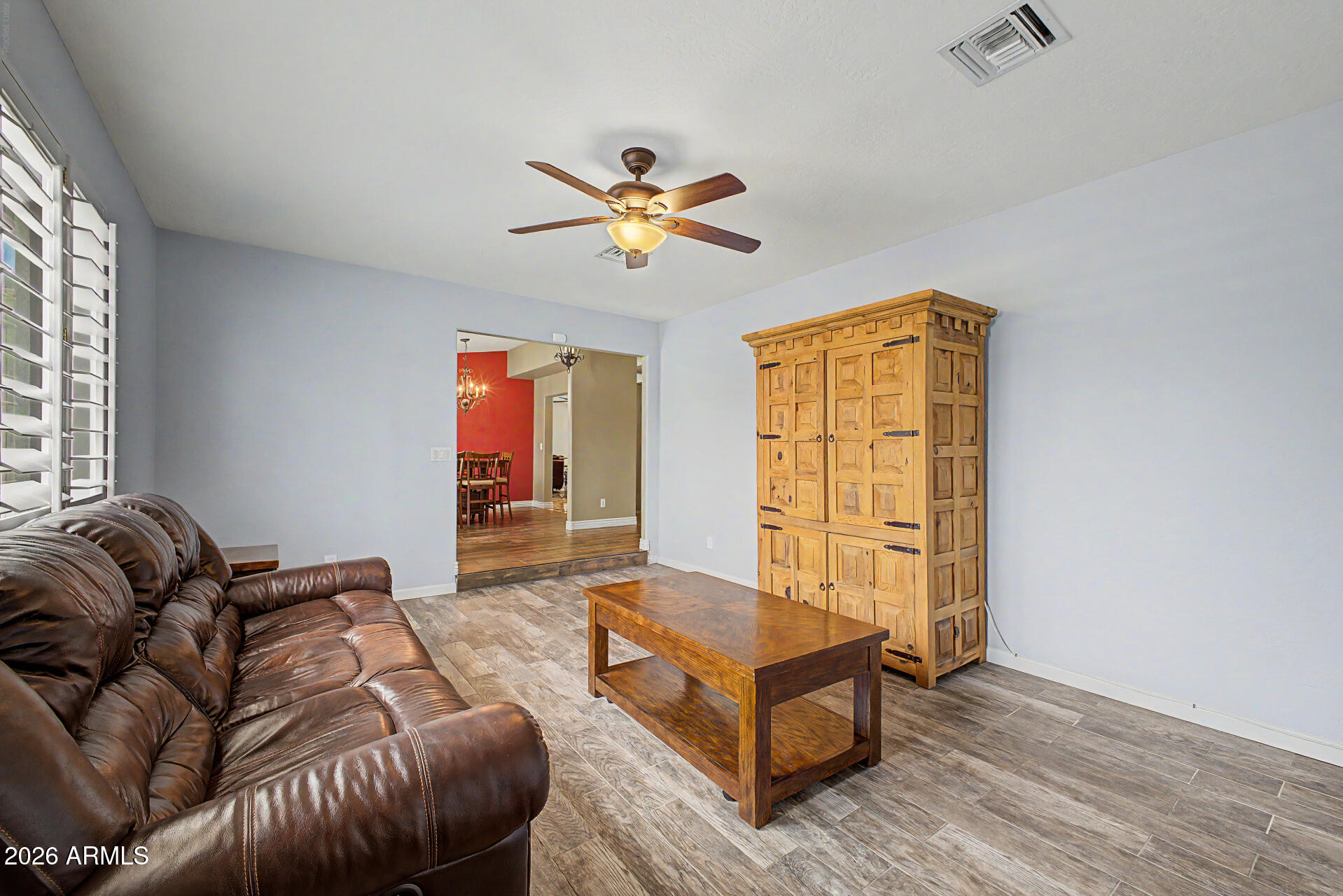 802 East Roberts Road Phoenix, AZ 85022 - Photo 3 of 24 a living room with furniture and a window