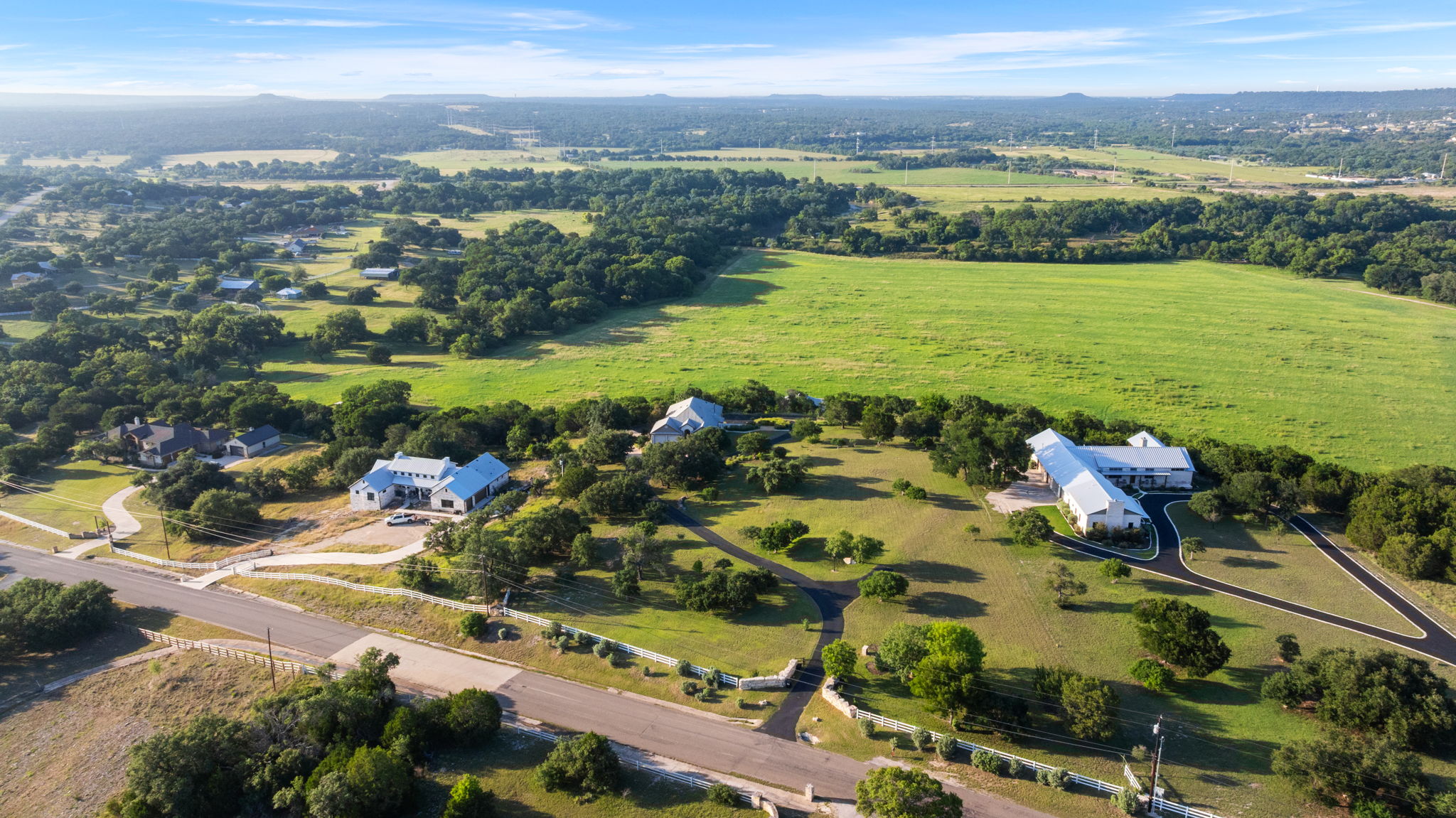 1427 River Ridge Ranch Road Killeen, TX 76549 - Photo 34 of 40 An aerial perspective reveals sprawling green landscapes surrounding multiple residences, offering a sense of privacy.