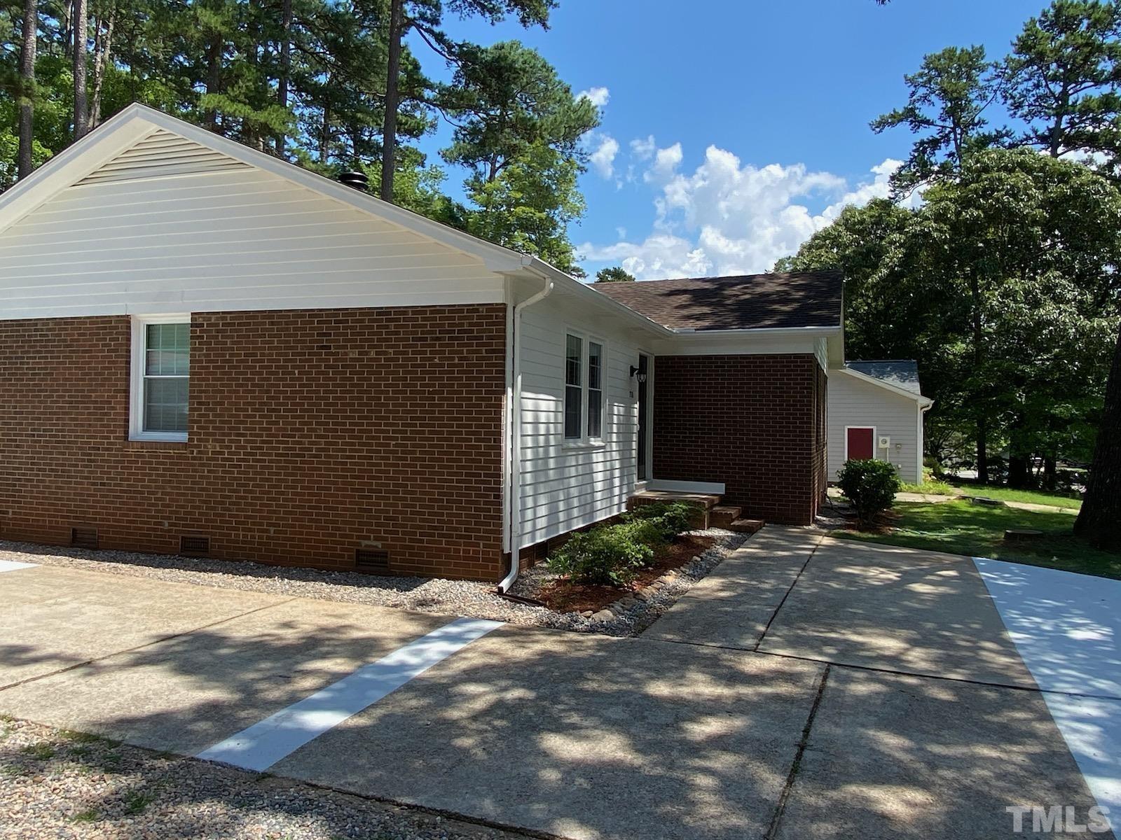 708 Sawmill Road Raleigh, NC 27615 - Photo 23 of 32 a backyard of a house with plants and trees