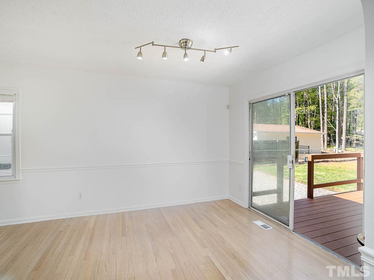 708 Sawmill Road Raleigh, NC 27615 - Photo 8 of 32 a view of an empty room and window