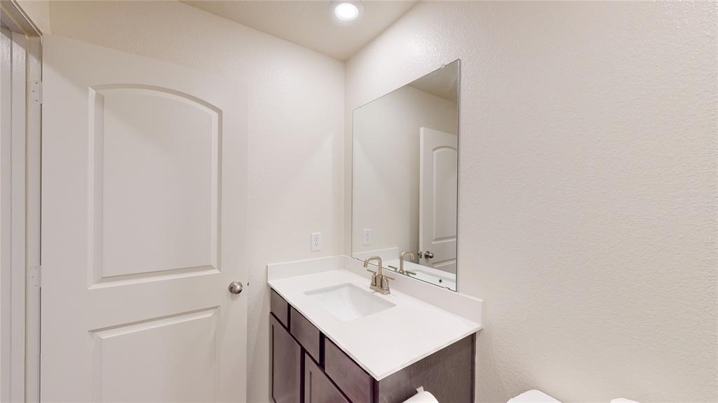 8012 White Sulphur Road Ponder, TX 76259 - Photo 11 of 39 Bathroom 1 -Bathroom with vanity, a textured wall, and recessed lighting