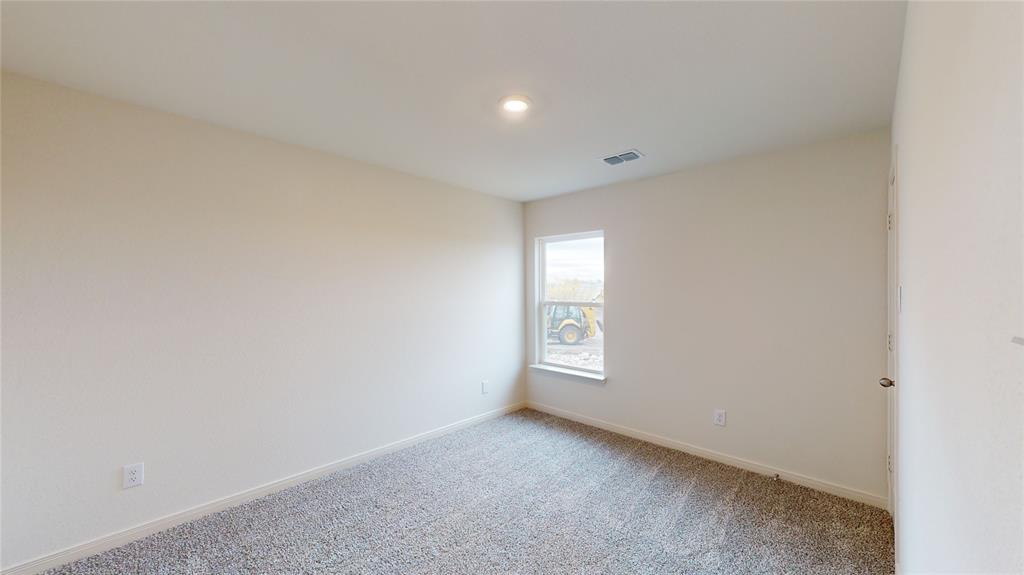 8012 White Sulphur Road Ponder, TX 76259 - Photo 13 of 39 Bedroom 2 - Carpeted empty room with baseboards