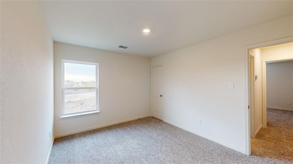 8012 White Sulphur Road Ponder, TX 76259 - Photo 14 of 39 Bedroom 2 -Unfurnished room with light colored carpet and baseboards