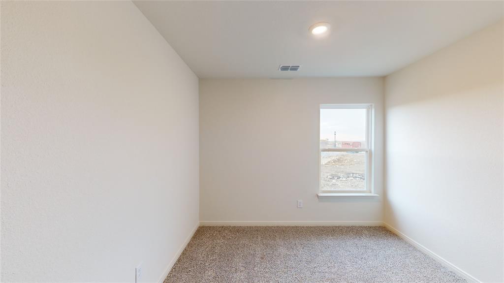 8012 White Sulphur Road Ponder, TX 76259 - Photo 17 of 39 Bedroom 3 - Spare room with light carpet and baseboards