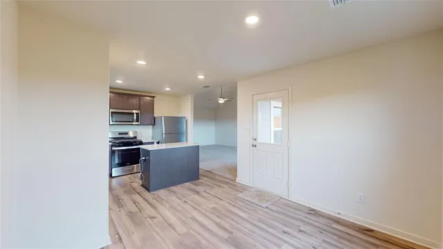a kitchen with a refrigerator a sink and a refrigerator